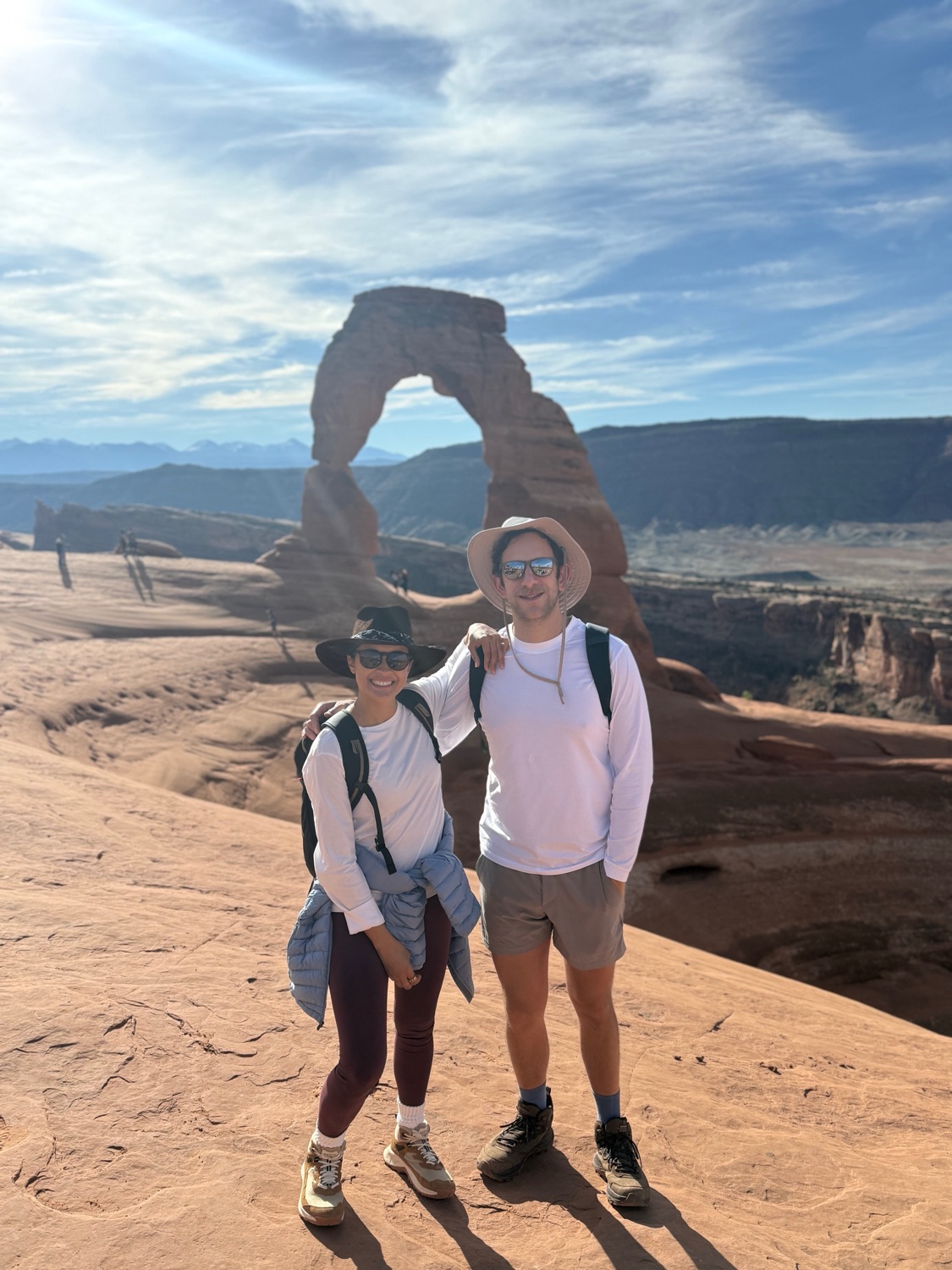 Salma and Eric in front of Delicate Arch in Arches National Park