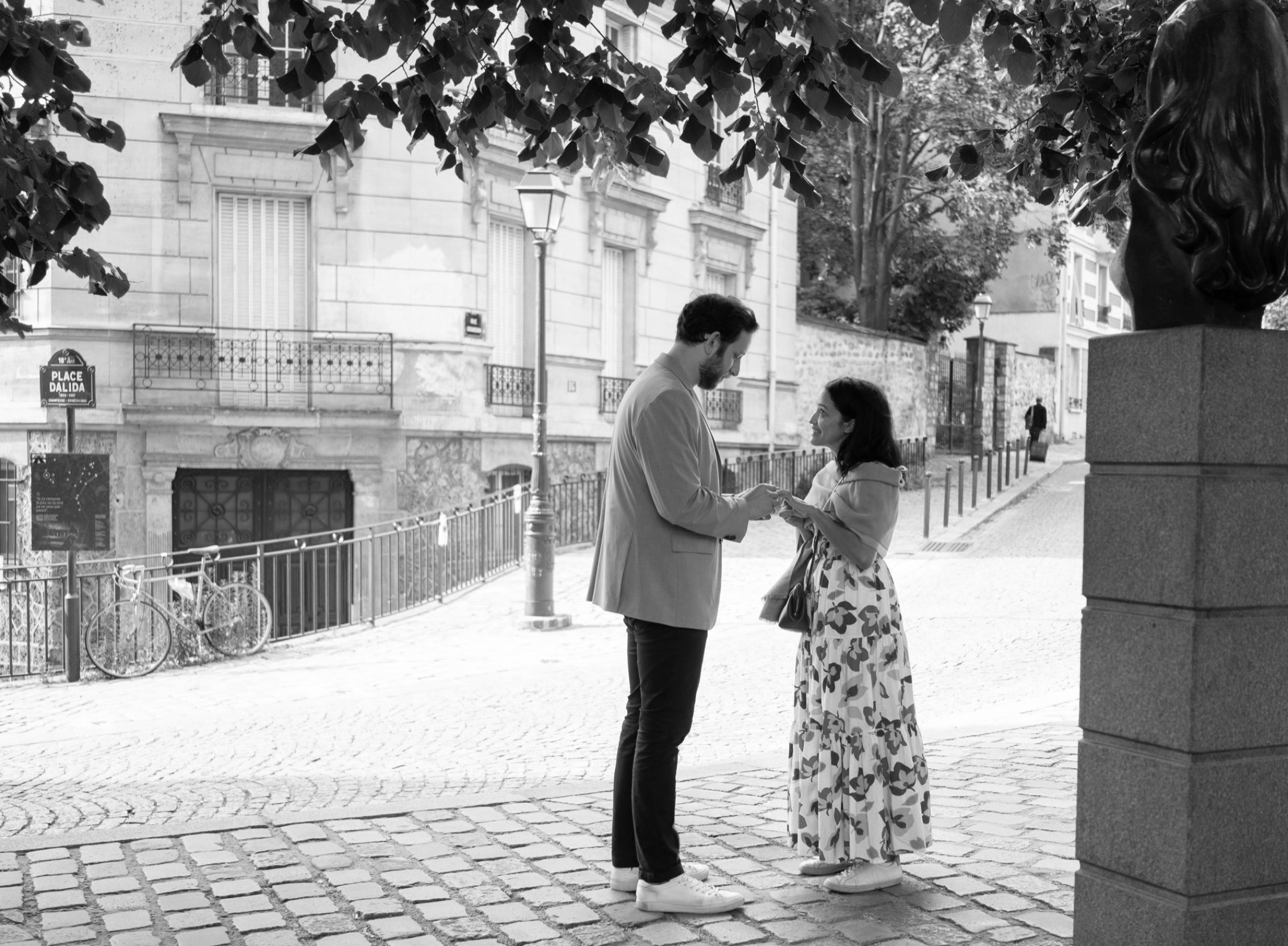 Eric proposing to Salma on a street in Montmartre, Paris